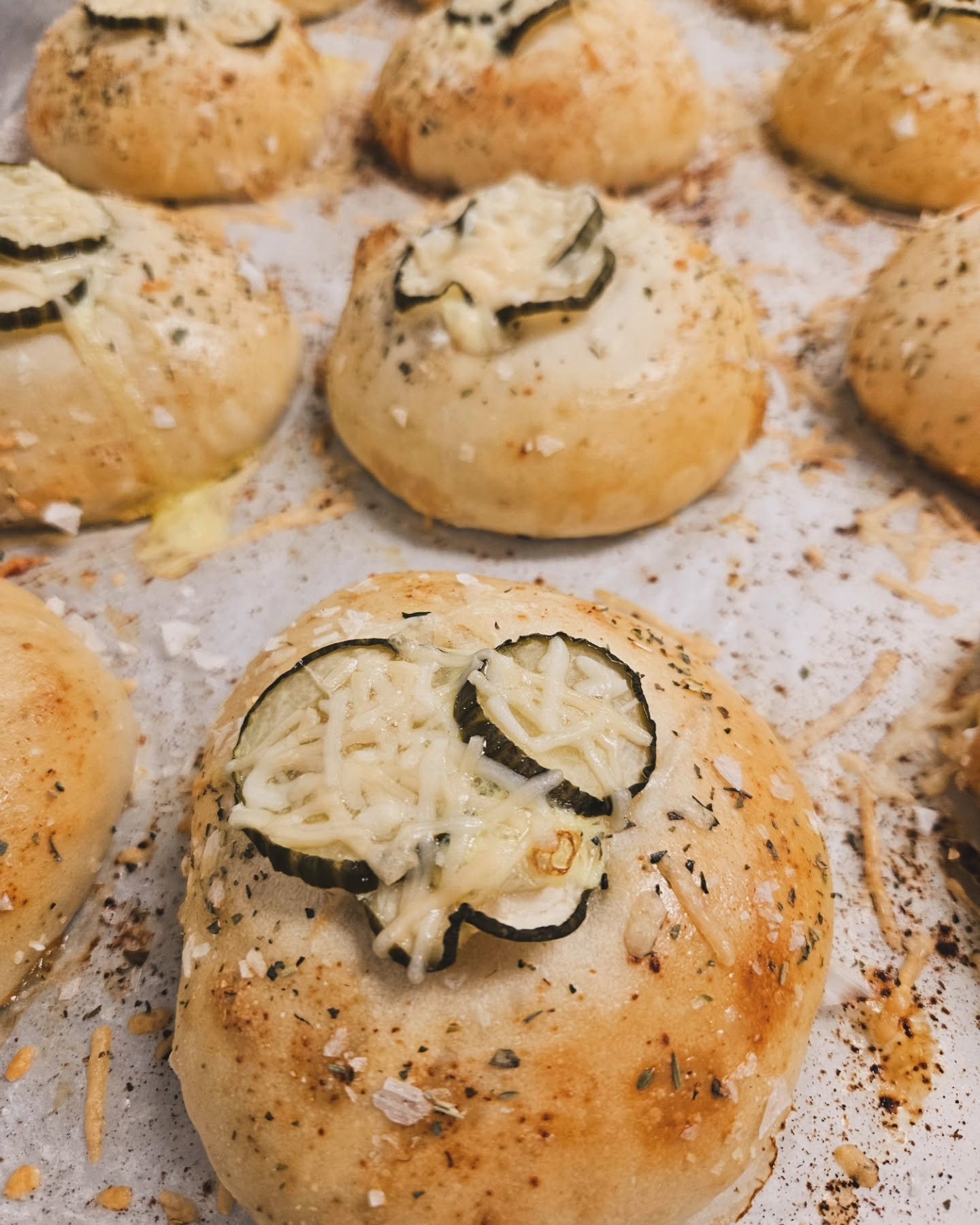 Pickle and cheese rolls on a sheet pan
